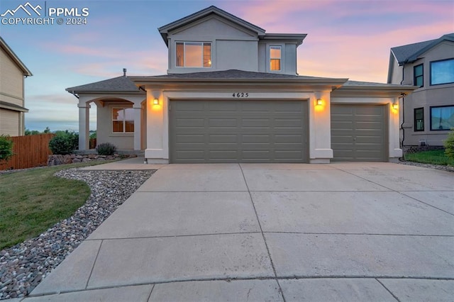 view of front of property with a garage