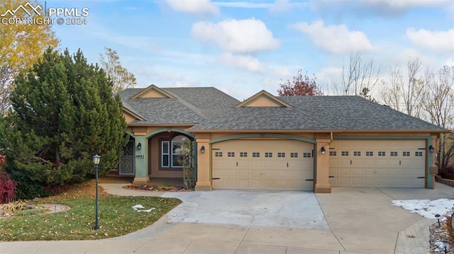 view of front facade featuring a front lawn and a garage