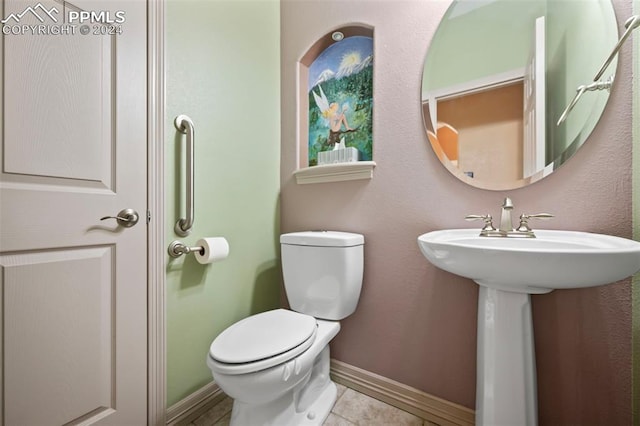 bathroom featuring tile patterned floors, sink, and toilet