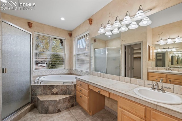 bathroom with vanity, tile patterned floors, and independent shower and bath