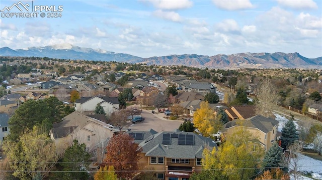 birds eye view of property with a mountain view