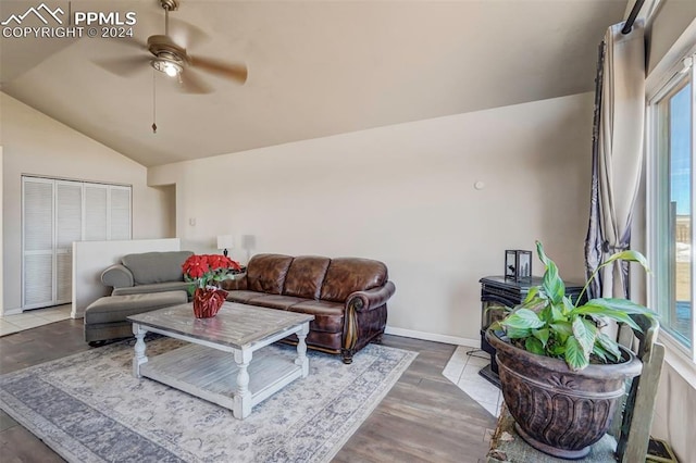 living room with ceiling fan, lofted ceiling, and hardwood / wood-style flooring