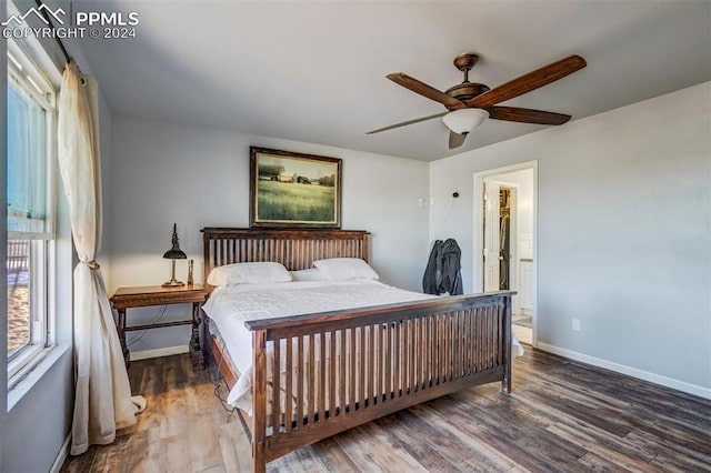 bedroom featuring wood-type flooring, connected bathroom, and ceiling fan