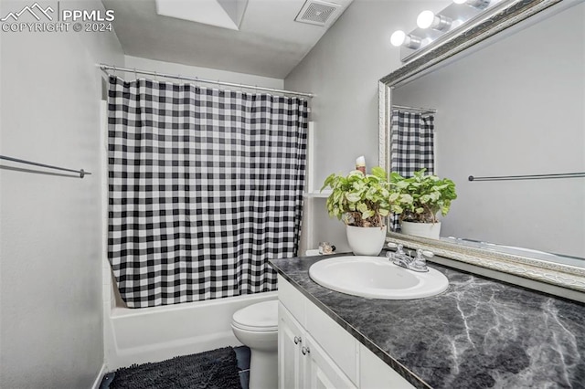 full bathroom featuring vanity, toilet, and shower / tub combo