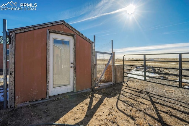 view of outbuilding with a rural view