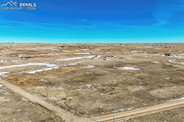 birds eye view of property with a rural view