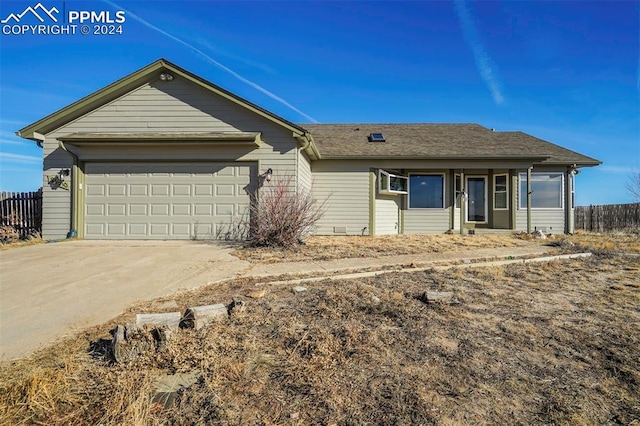 ranch-style home with a garage