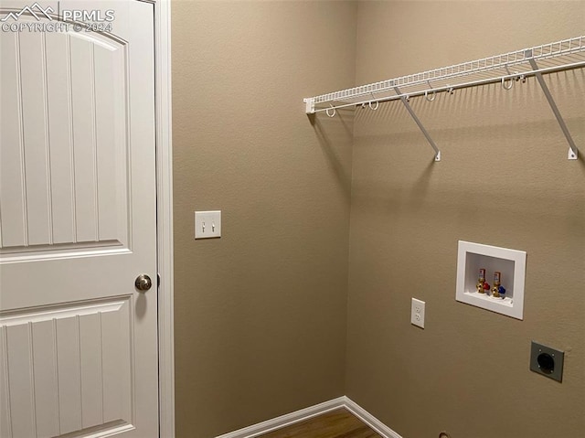 laundry area featuring electric dryer hookup, washer hookup, and hardwood / wood-style flooring