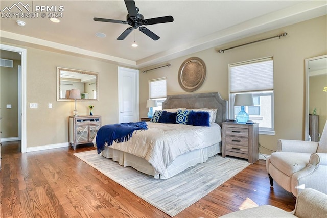 bedroom with ceiling fan and wood-type flooring