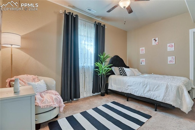 bedroom with ceiling fan and carpet floors