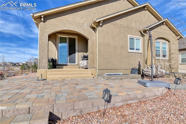 rear view of house with a patio area