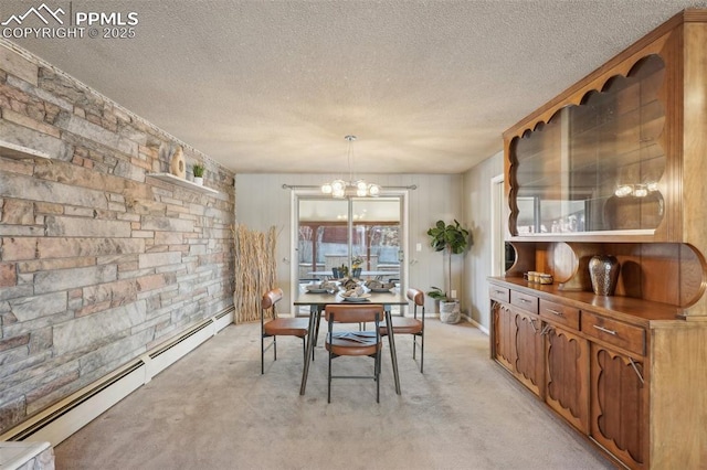 dining room with an inviting chandelier, a textured ceiling, light carpet, and a baseboard heating unit