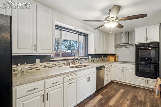 kitchen featuring wall chimney range hood, sink, white cabinetry, dark hardwood / wood-style floors, and black appliances