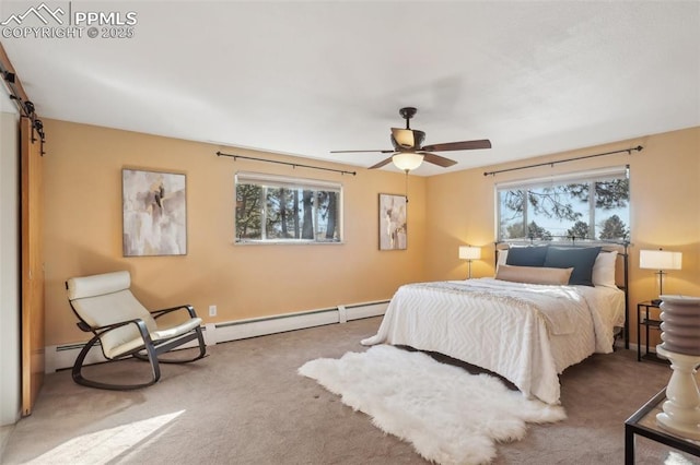 carpeted bedroom featuring multiple windows, a barn door, and ceiling fan