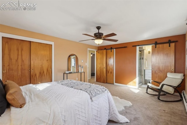 bedroom featuring ceiling fan, baseboard heating, a barn door, light carpet, and a closet