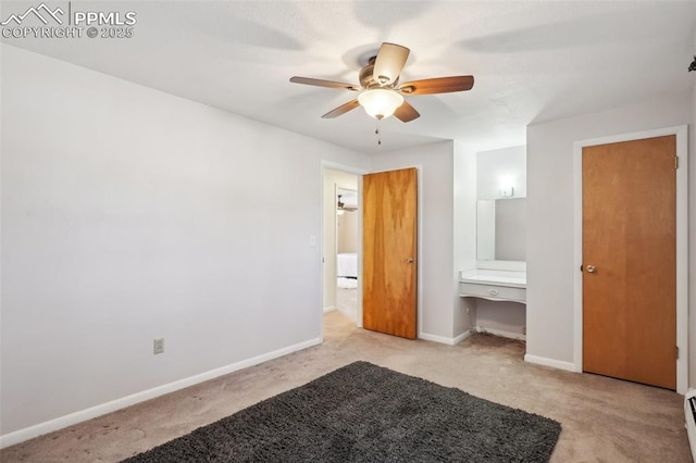 unfurnished bedroom featuring ceiling fan, light colored carpet, and a baseboard radiator