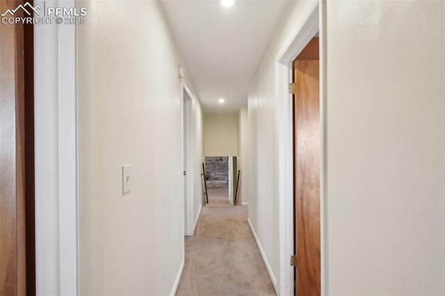 corridor with light colored carpet