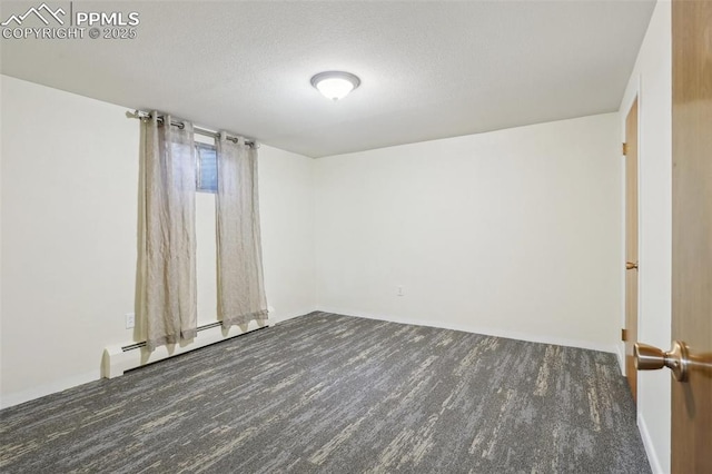 unfurnished room with a baseboard radiator and a textured ceiling