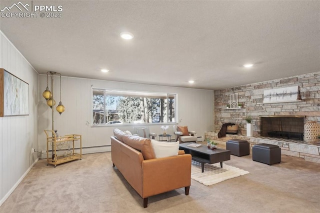 living room featuring baseboard heating, a stone fireplace, light carpet, and a textured ceiling