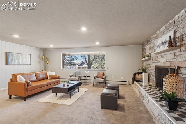 living room with baseboard heating, light colored carpet, a fireplace, and a textured ceiling