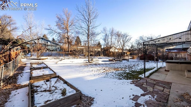 snowy yard with a pergola