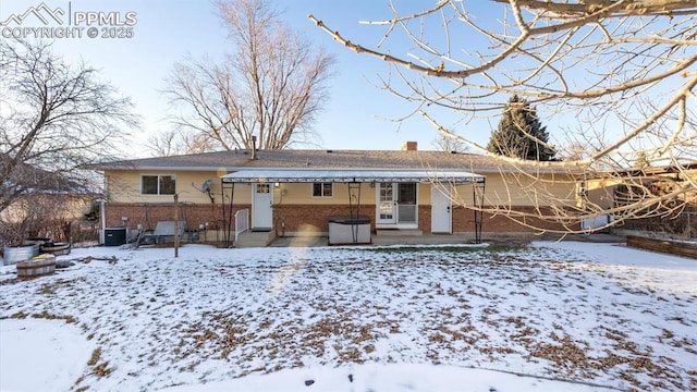 view of snow covered house