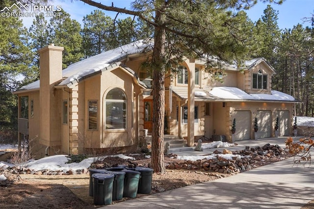 view of front of property with a garage