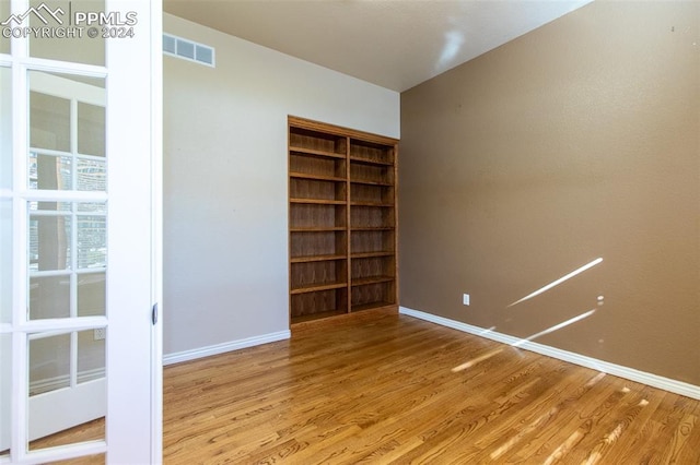 spare room featuring light hardwood / wood-style floors