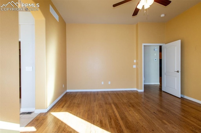 spare room featuring ceiling fan and hardwood / wood-style floors