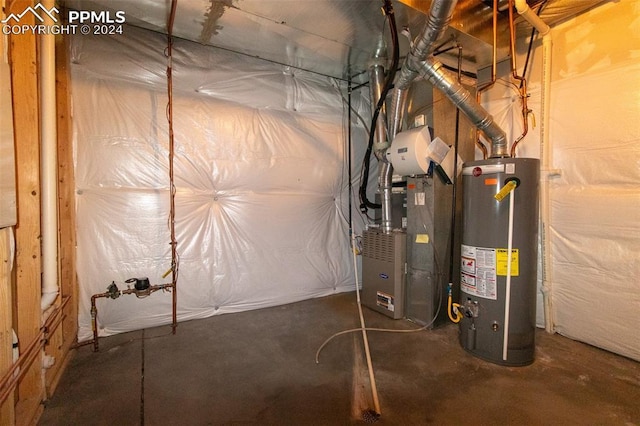 utility room featuring heating unit and water heater