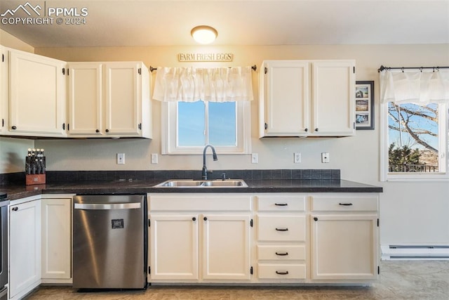 kitchen featuring white cabinets, stainless steel dishwasher, plenty of natural light, and sink