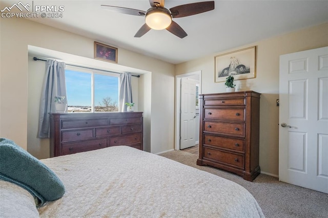 bedroom with light colored carpet and ceiling fan