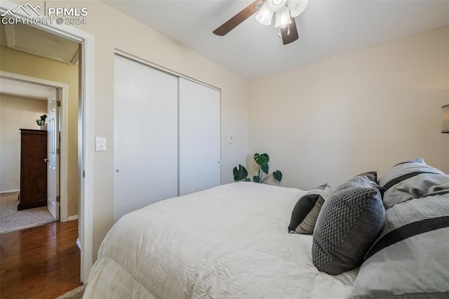 bedroom featuring a closet, ceiling fan, and hardwood / wood-style floors