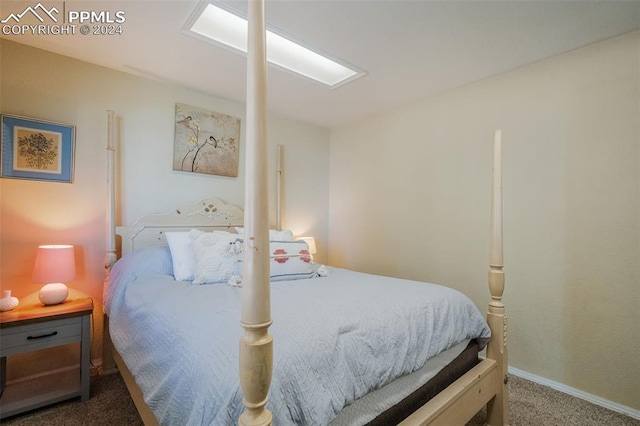 bedroom with dark colored carpet