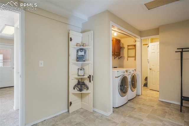 laundry room with cabinets and washing machine and dryer