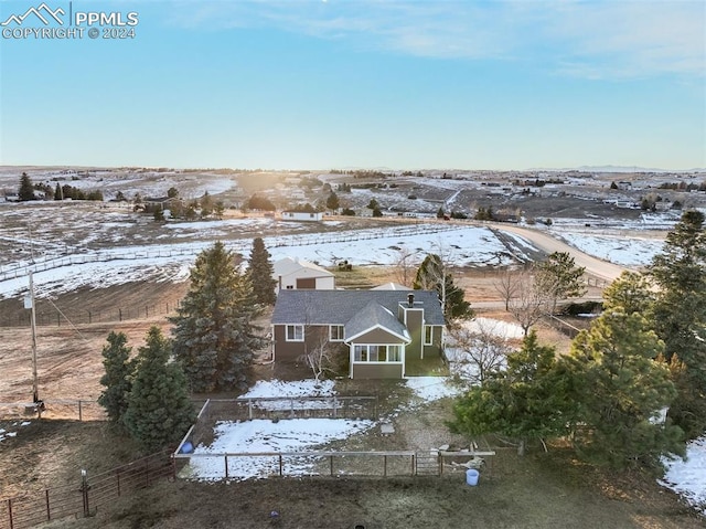 snowy aerial view with a rural view