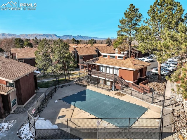 view of swimming pool with a mountain view