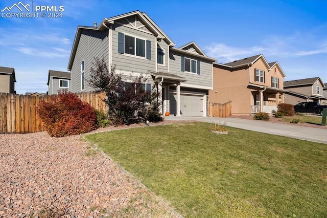 view of front of house featuring a front yard and a garage