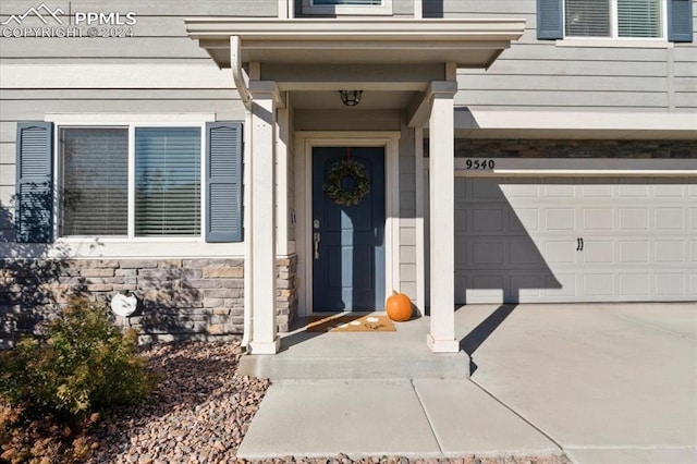 entrance to property featuring a garage