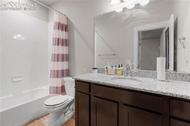 full bathroom featuring vanity, toilet, and shower / bathtub combination with curtain