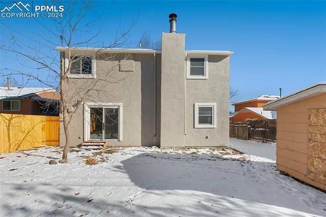 view of snow covered house