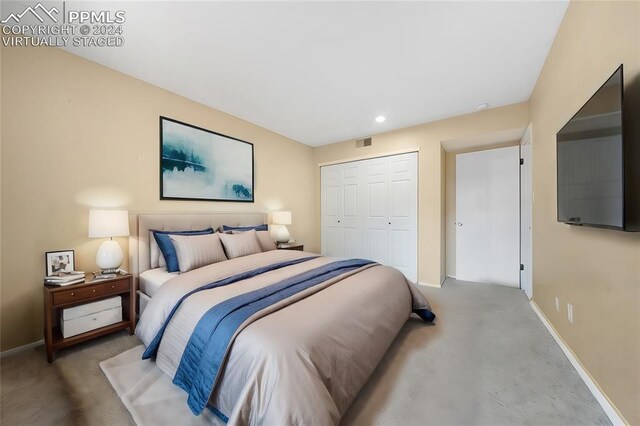 bedroom featuring a closet and concrete flooring