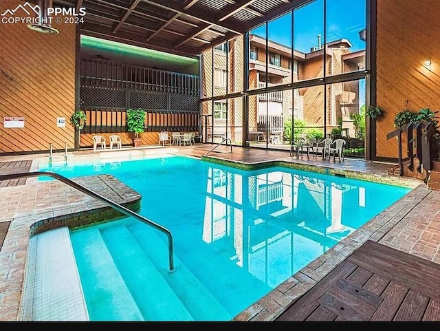 view of swimming pool with a patio area