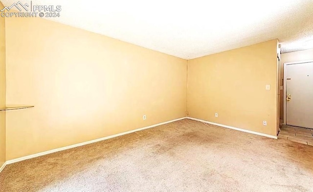 empty room featuring carpet