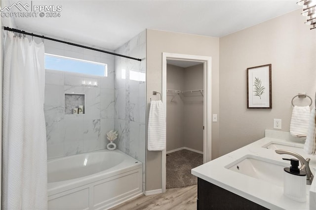 bathroom featuring shower / bath combo with shower curtain, vanity, and wood-type flooring