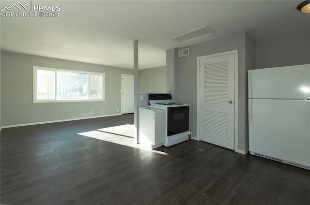 kitchen with white appliances, white cabinetry, and dark wood-type flooring