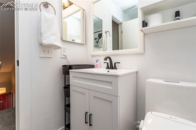 bathroom with vanity and toilet