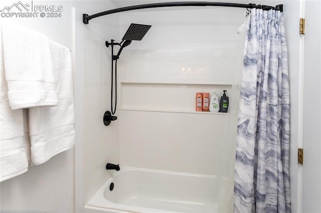 bathroom with shower / bath combination with curtain