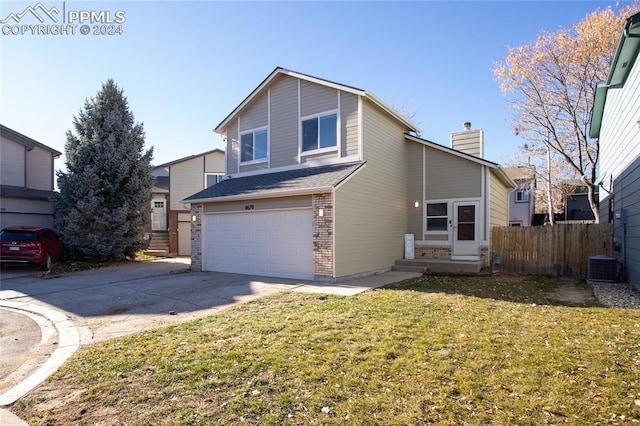 front facade with a garage, central air condition unit, and a front yard