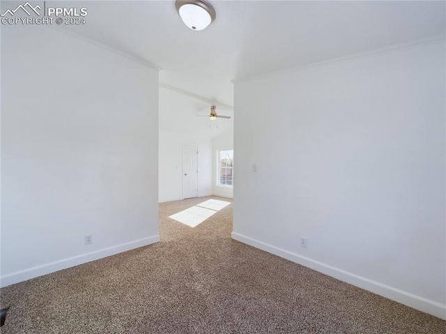 unfurnished room featuring light carpet, ceiling fan, and ornamental molding